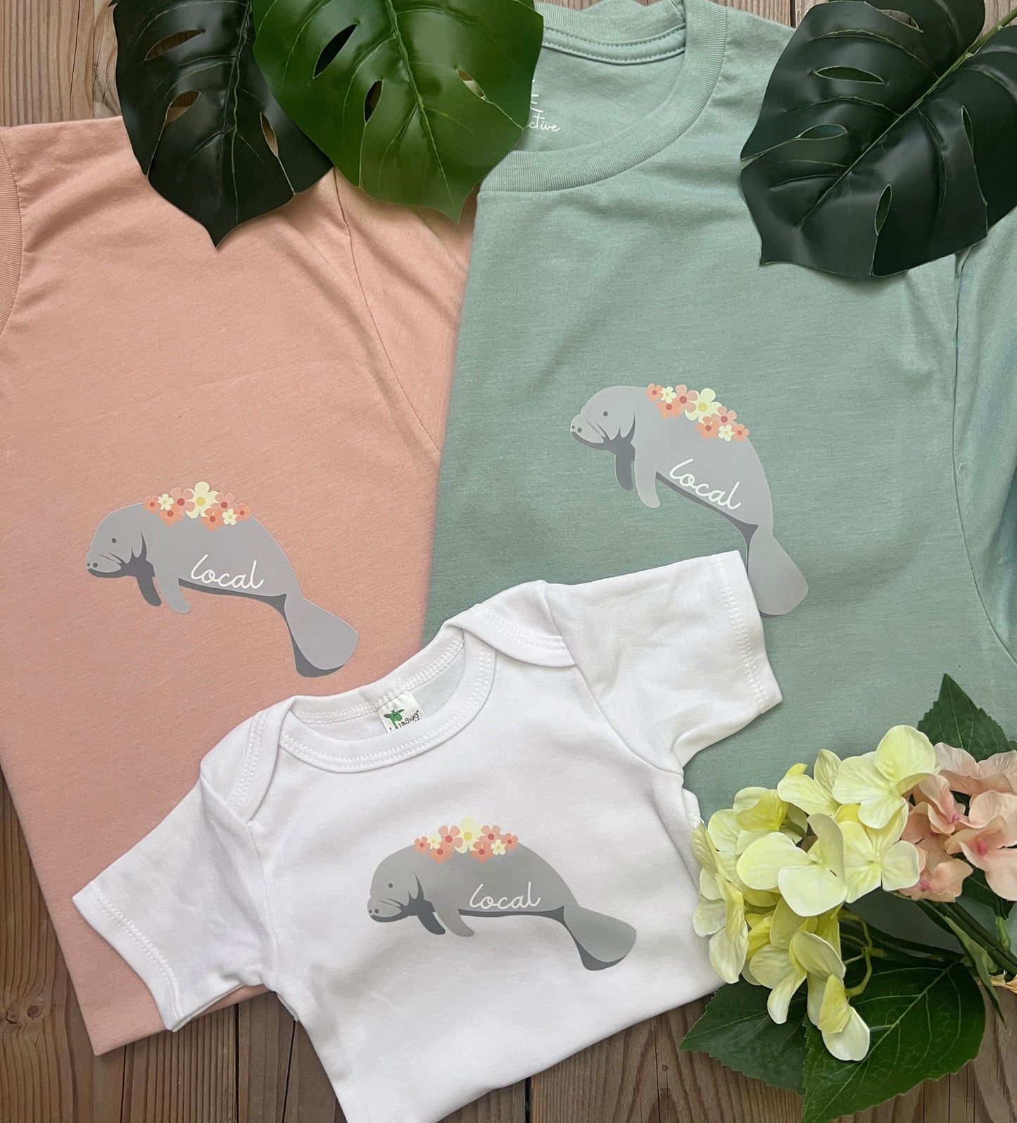 'Local' manatee baby bodysuit