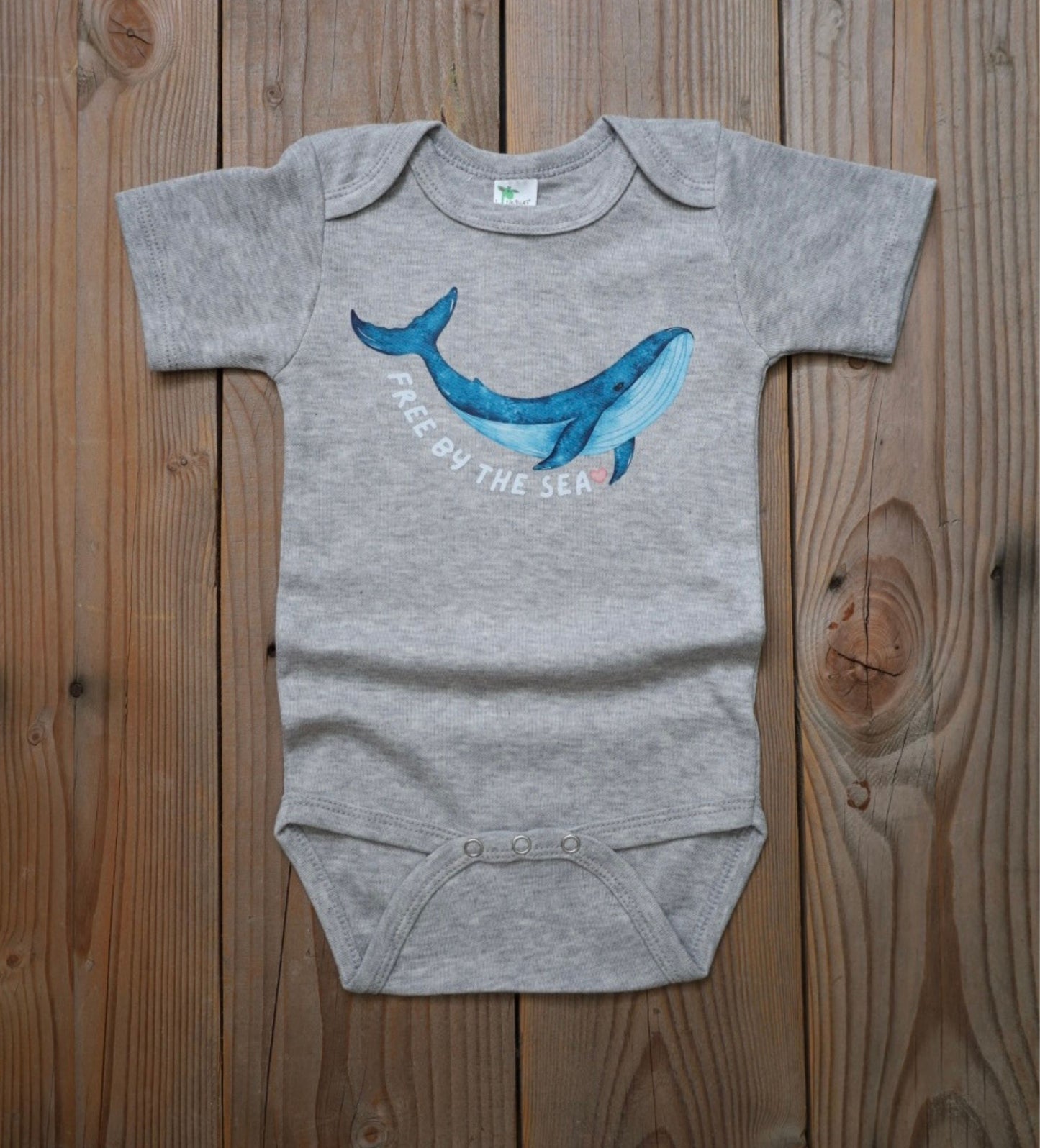 'Free by the Sea' baby whale bodysuit