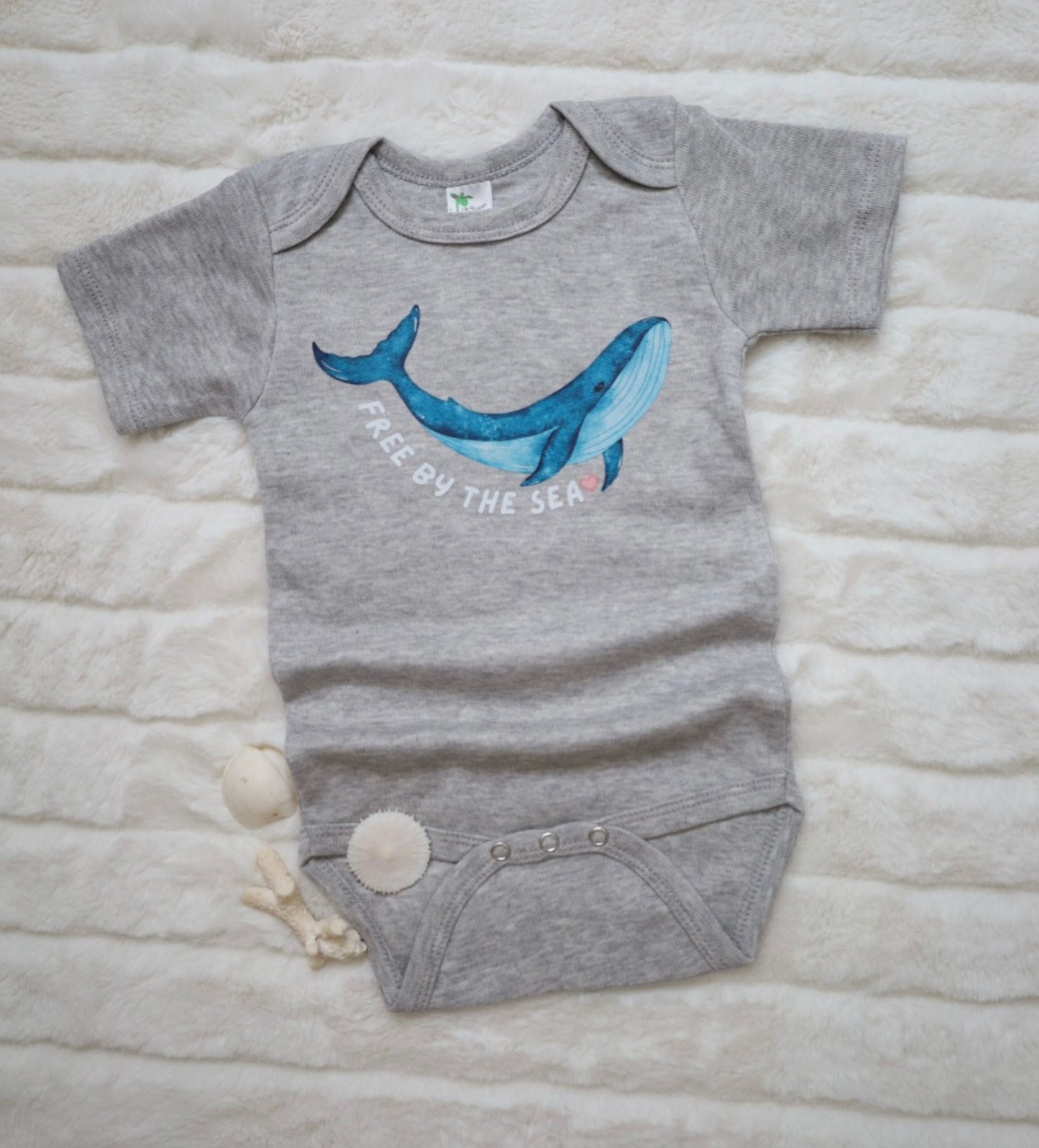 'Free by the Sea' baby whale bodysuit