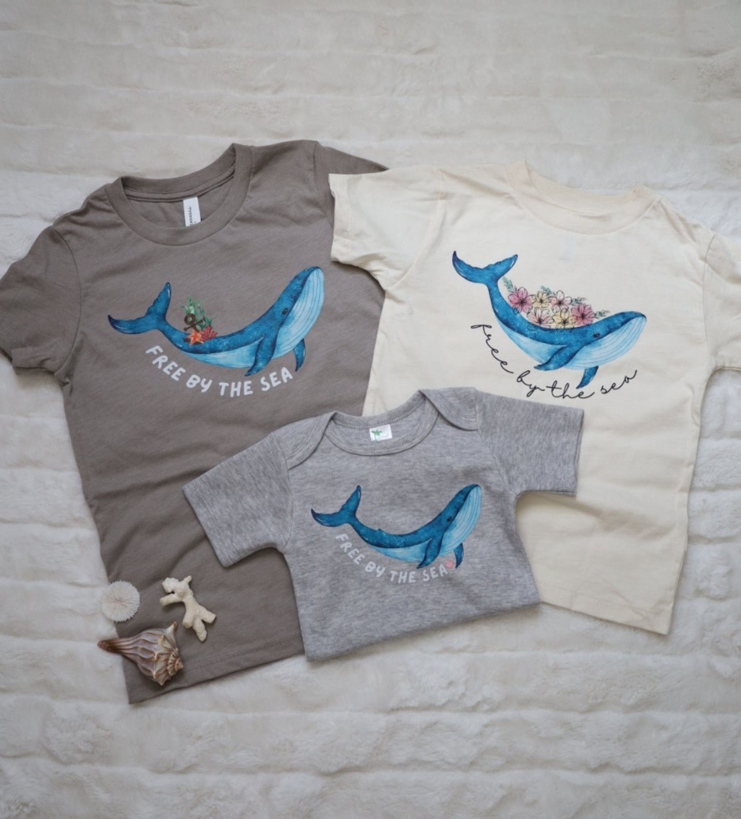 'Free by the Sea' baby whale bodysuit